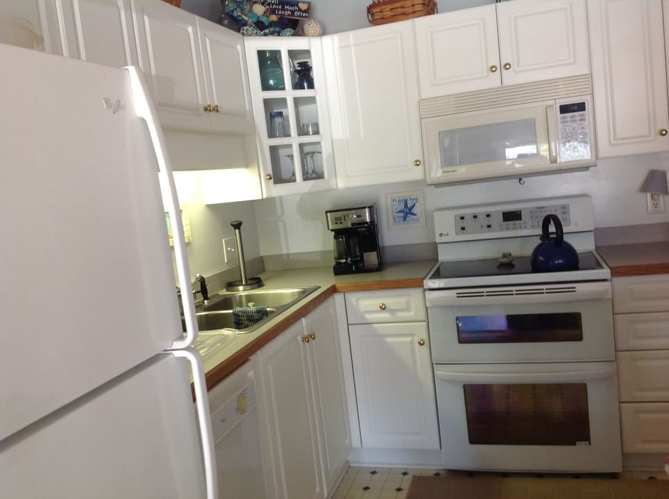 Kitchen hosts many amenities and appliances