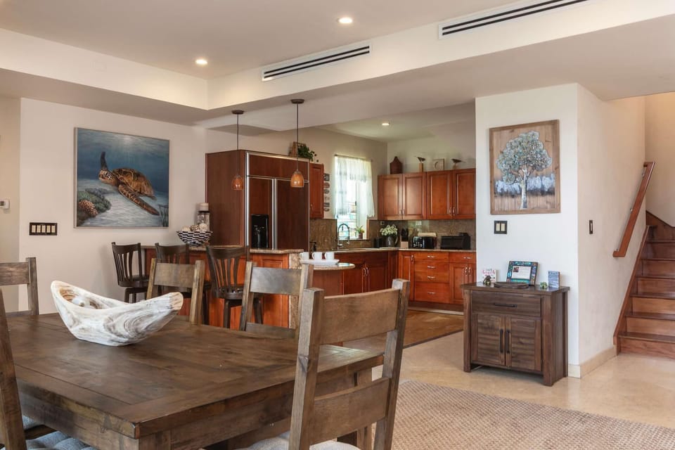 Spacious dining area flowing into a warm, open kitchen