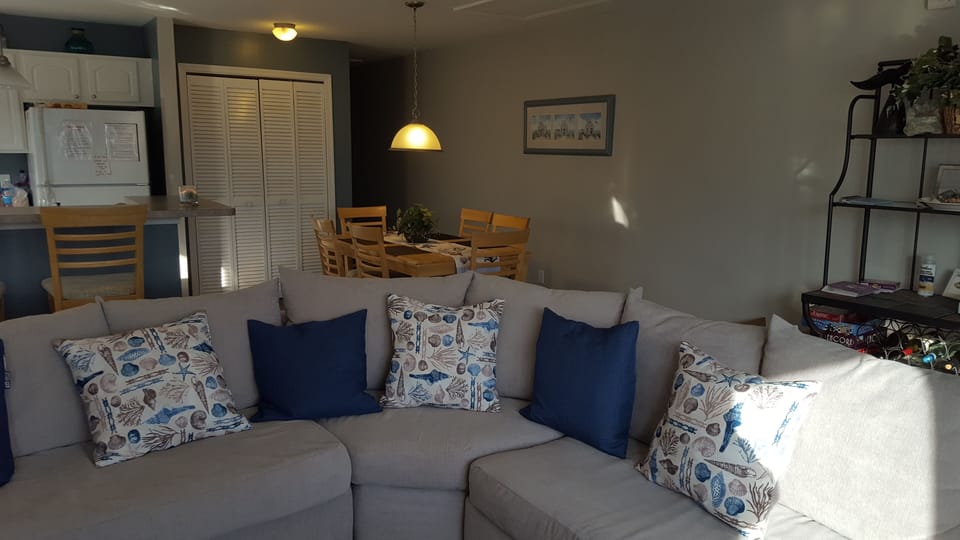 Large newly upholstered wrap around sofa