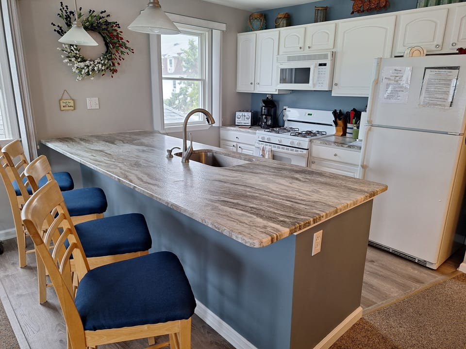 Kitchen with large Marble island