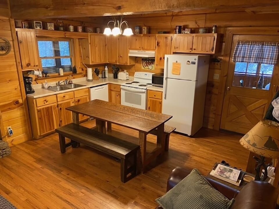 View of kitchen from top of downstairs steps