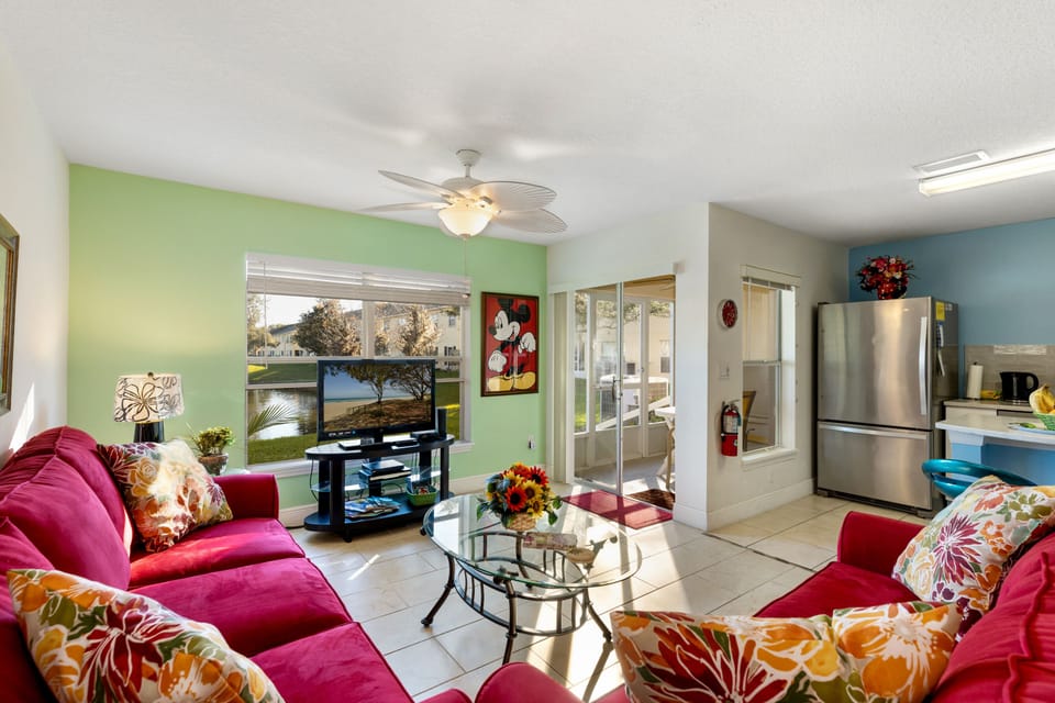 LIVING ROOM WITH VIEW OF LAKE...
NEW TROPICAL CEILING FAN...AND MICKEY TOO!