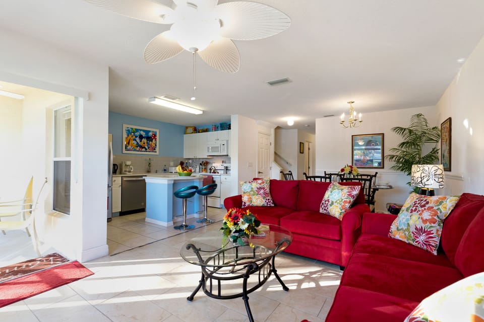 VIEW FROM THE LIVING ROOM TO THE KITCHEN AND OUTDOOR SCREENED PORCH...