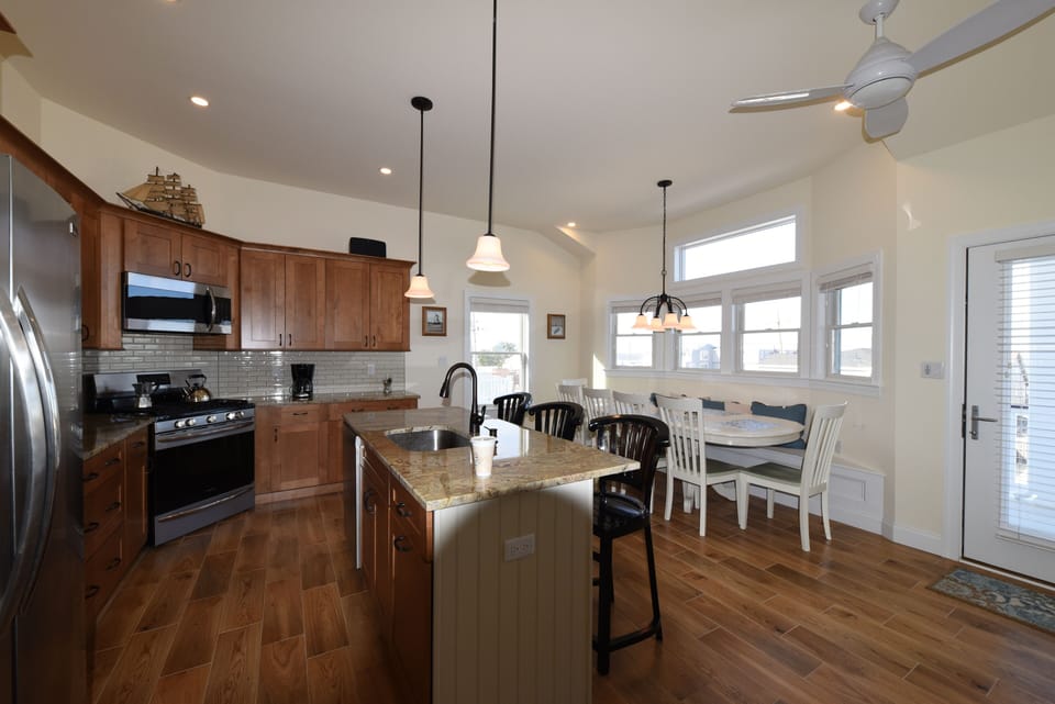 Kitchen And Dining Area On Second Floor Opens Onto Veranda With Bay View