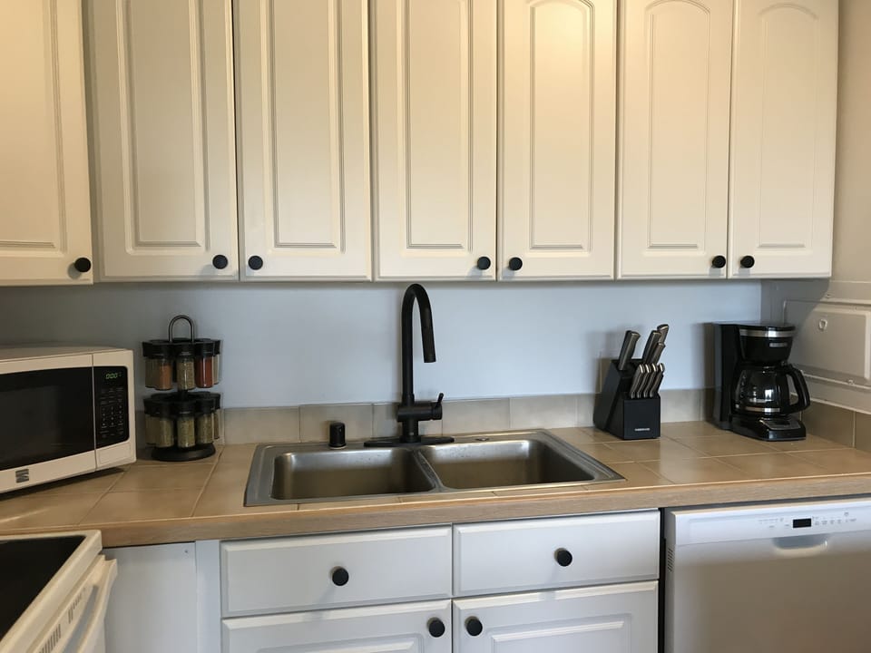 Coffee maker, microwave, spices and pull out faucet