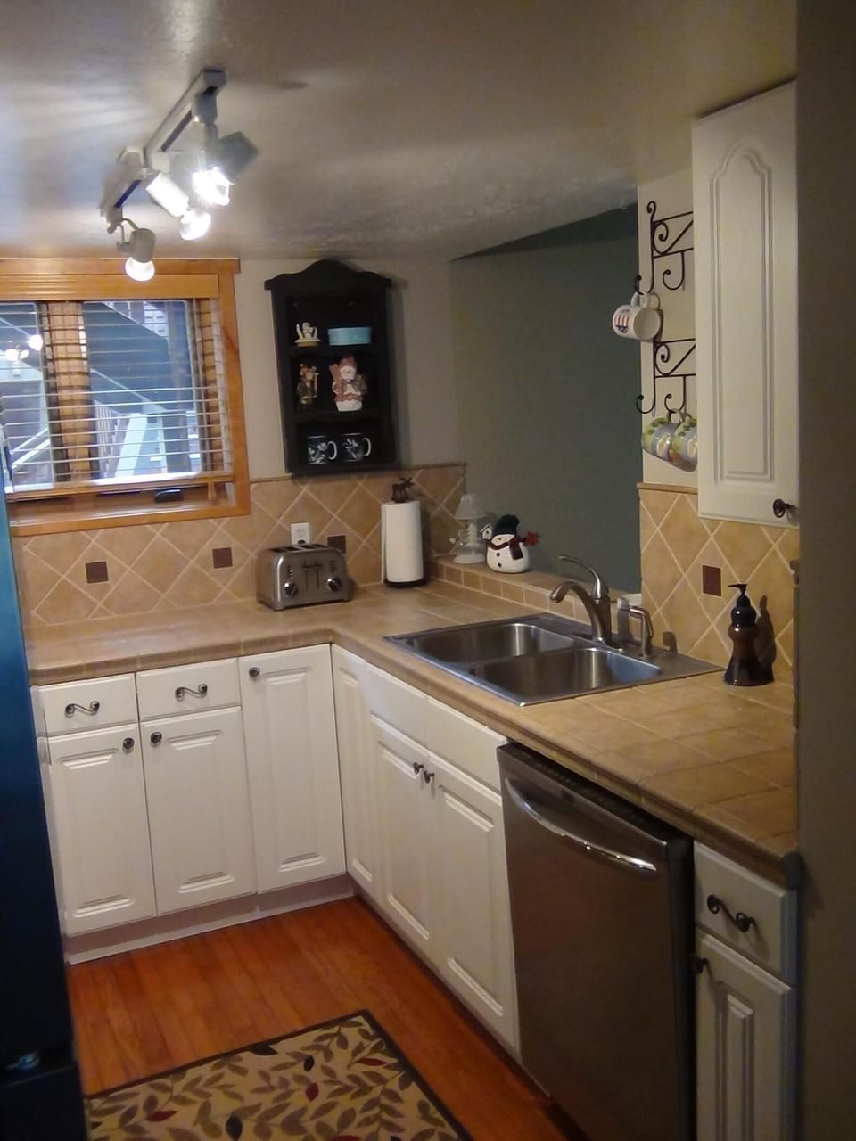 Kitchen has 2 large bowl stainless steel sink and Kohler faucet