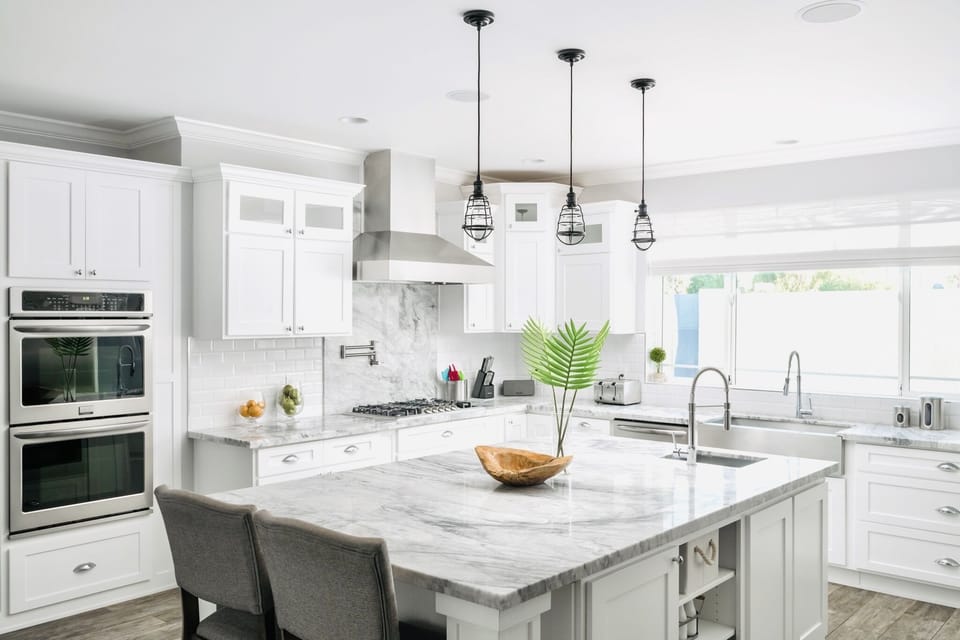 Fully-equipped chef's kitchen with double ovens, double sinks, oversized refrigerator and large walk-in pantry.
