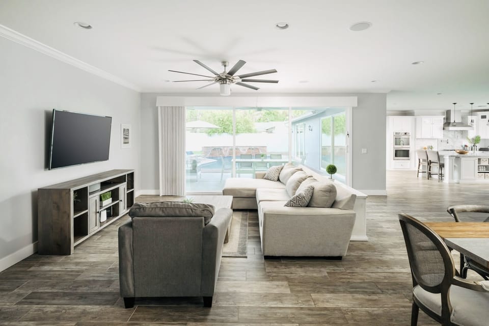 Open-layout with multiple sliders allows guests to enjoy indoor/outdoor living.