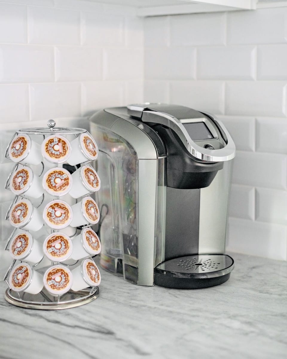 A warm cup of coffee awaits you from the Keurig machine and fully-stocked k-cup carousel.