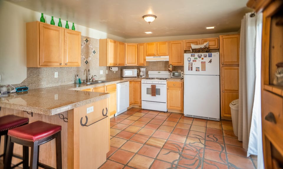 Large sliding window in kitchen to enjoy the views.
