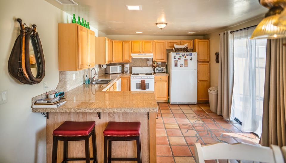 Large open kitchen with convenient bar stool seating.