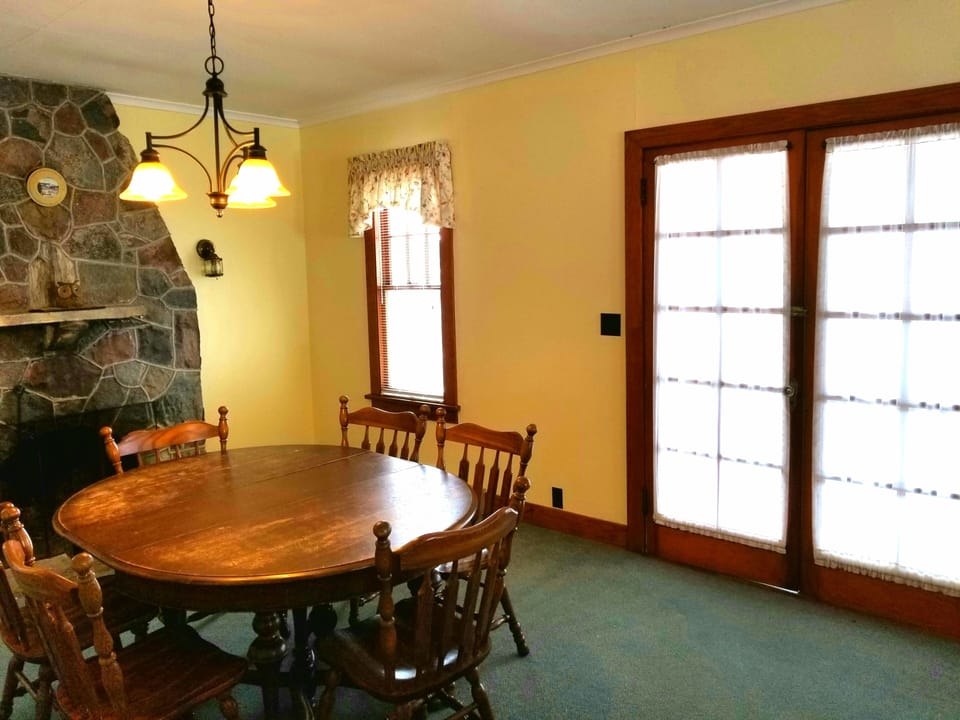 Dining room and French doors leading to screened in porch.