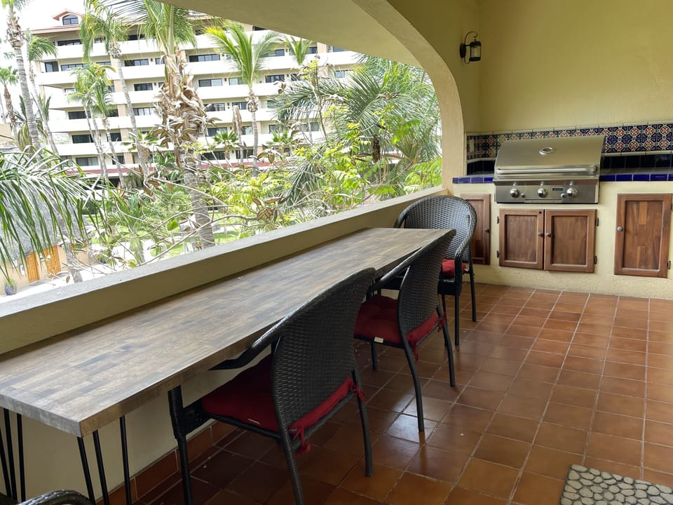 Spacious front balcony with courtyard view.