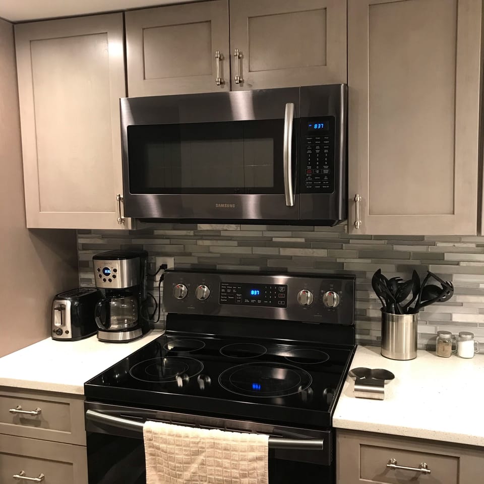 Samsung convection oven and stove and above Samsung microwave 