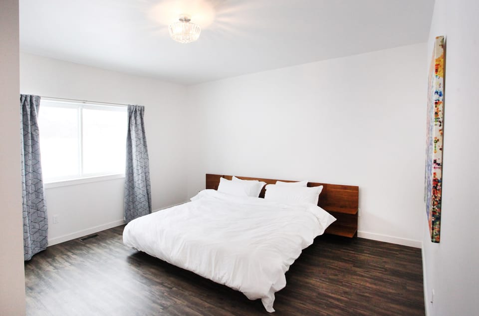 Downstairs bedroom with views of the orchards and mountains