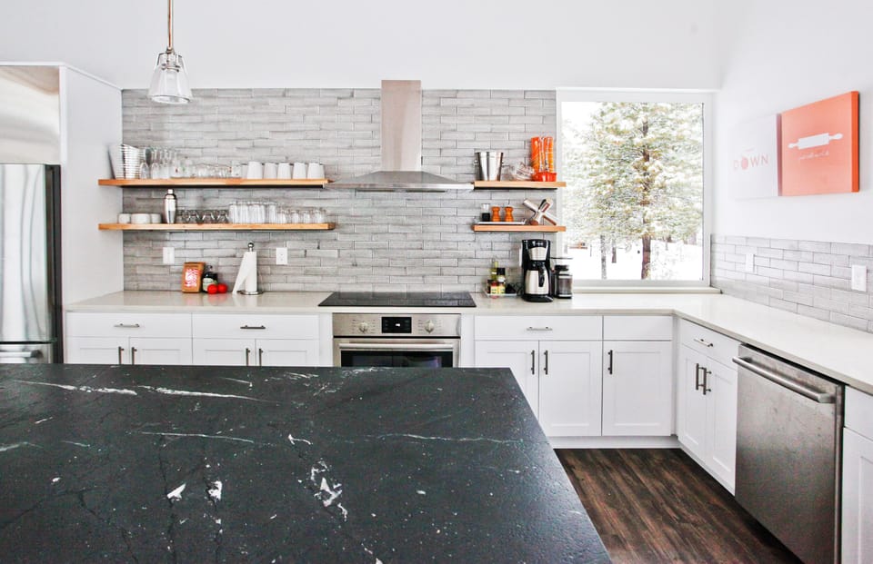Kitchen is equipped with Bosch appliances, cookware and dinnerware