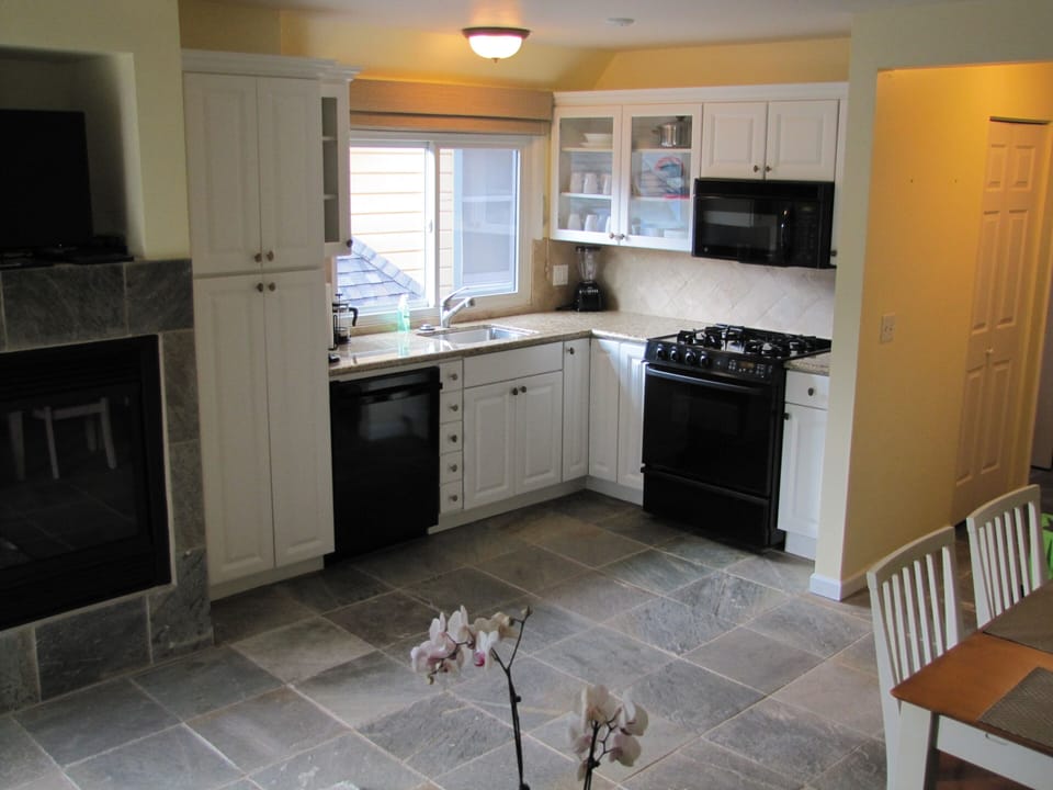 Kitchen, new appliances and dining area.  Gas Fireplace.