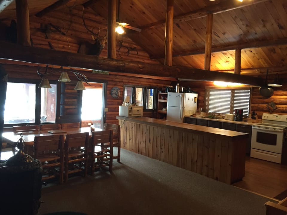 The open kitchen and dining room - windows overlooking the lake. 
