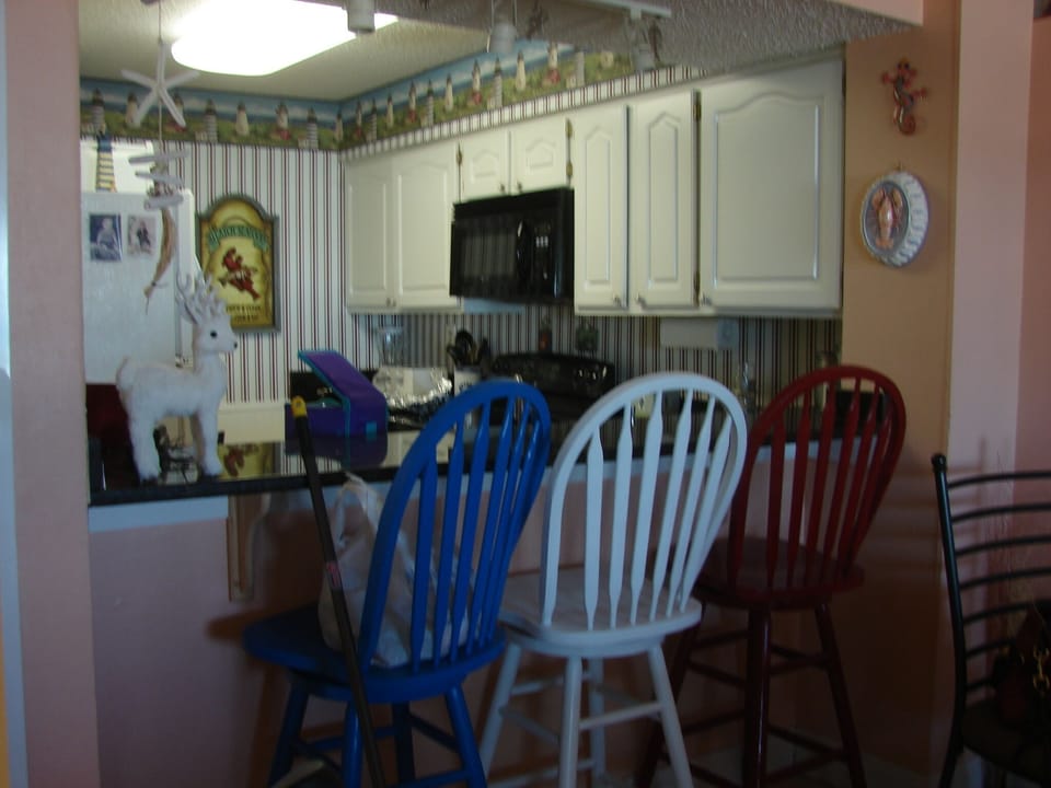 Bar area with seating for 3 more guests 