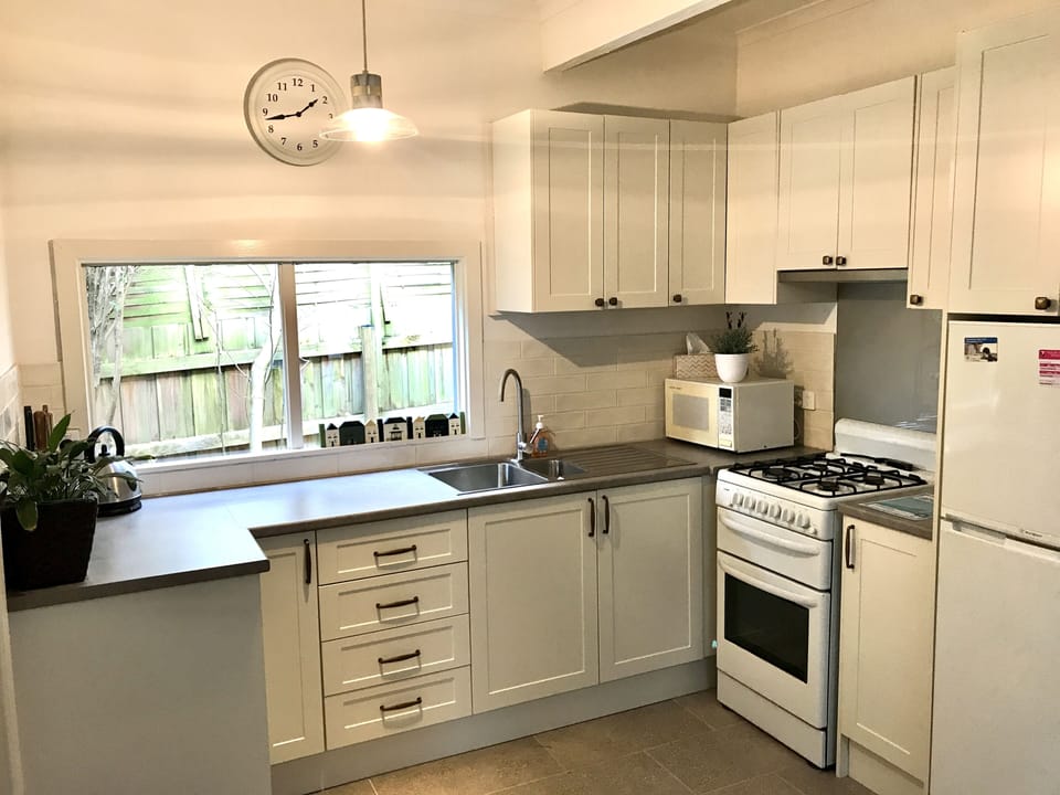 Newly renovated kitchen with cooking pans, crockery and cutlery at your disposal