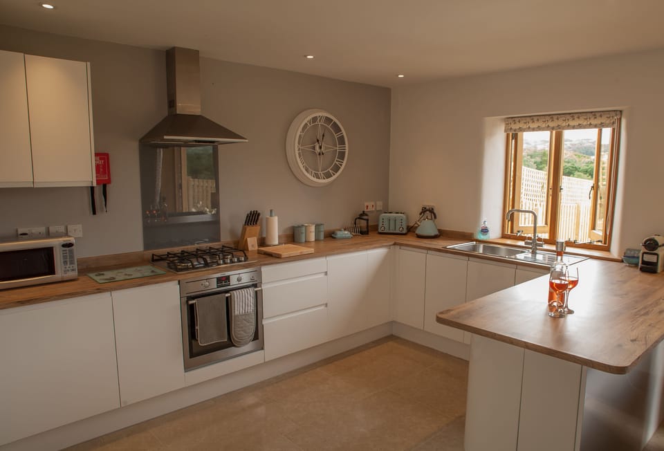 Lower ground floor: Open-plan fully fitted kitchen with views