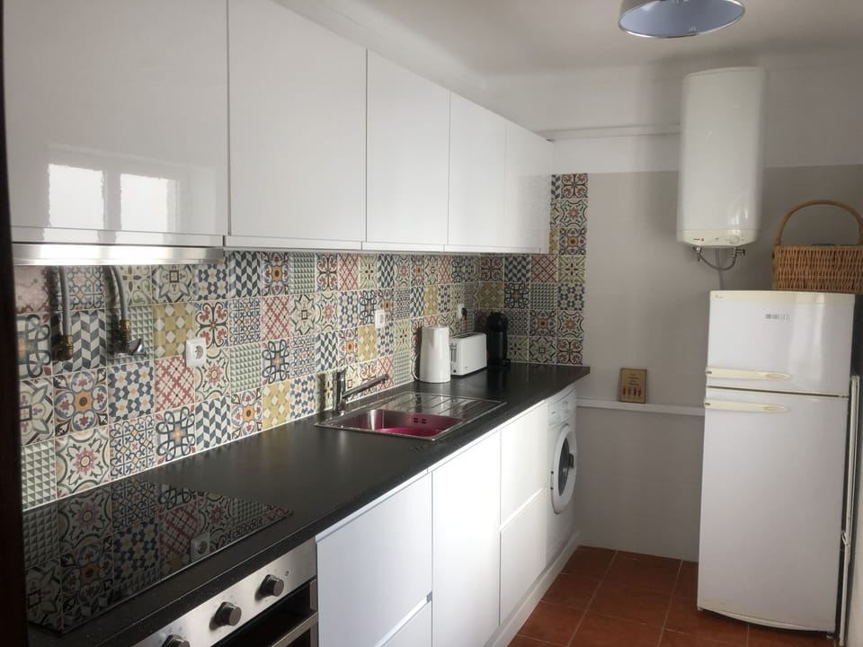 Kitchen with electric oven, hob, washing machine, fridge freezer, fully equipped
