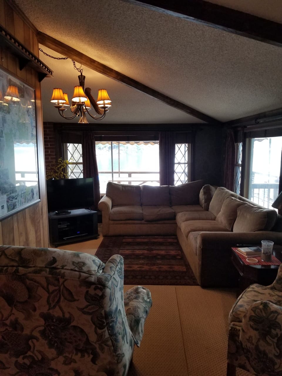 Living room with large windows to deck