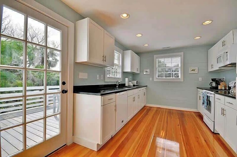 The kitchen has door to the back deck for quick lunches.