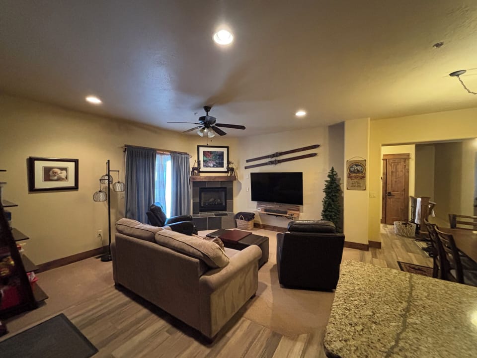 60” flat screen TV w/full cable, DVD blue-ray player, Roku, and sound bar. 