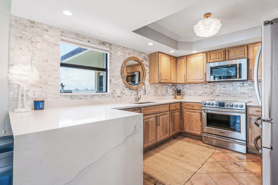 Quartzite counters, new appliances and fully stocked kitchen.  Ocean views!
