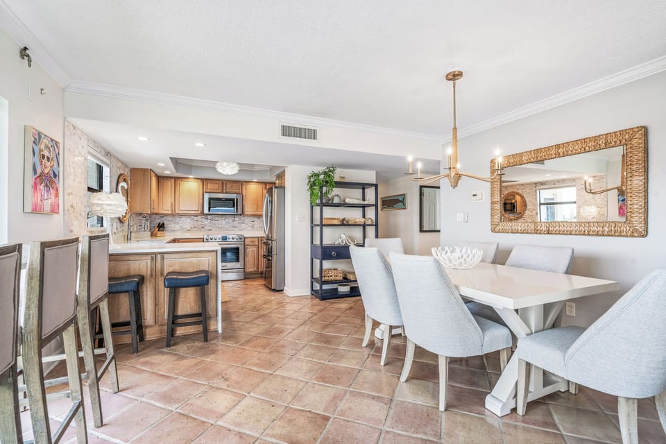Full stocked kitchen and two counter height stools.