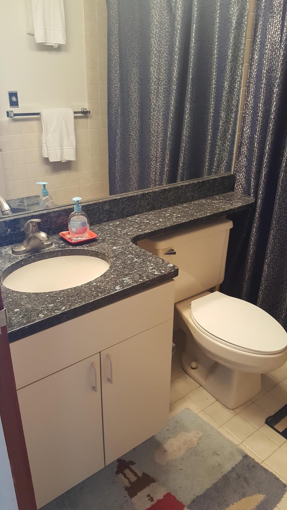 Updated full size bathroom with granite countertops and bathtub/shower combo.