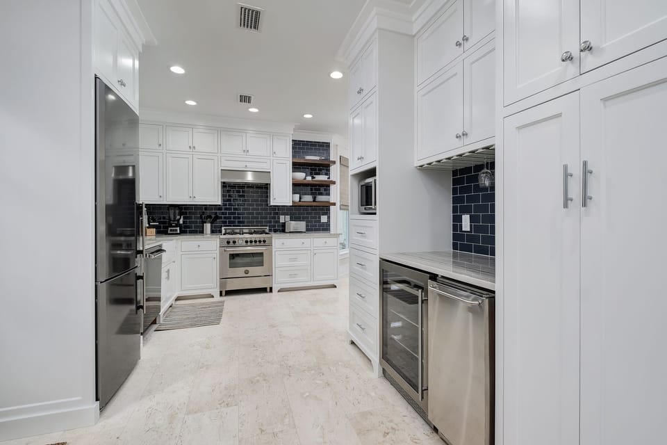 Wine bar with beverage fridge and ice maker.