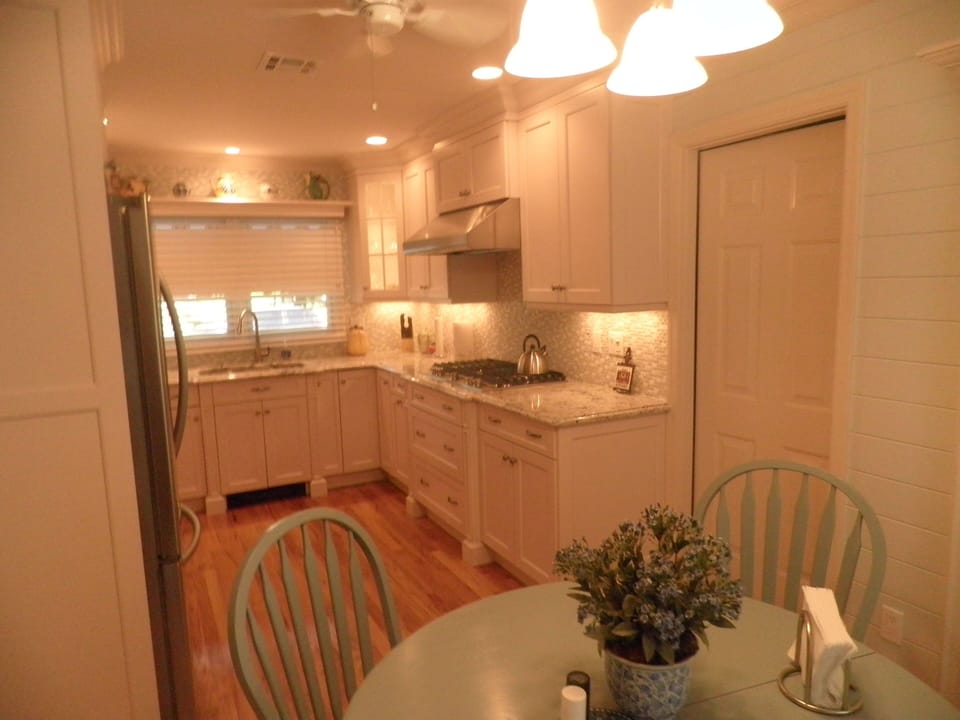 Eat-in Kitchen with Garage Entrance and Built-In Pantries