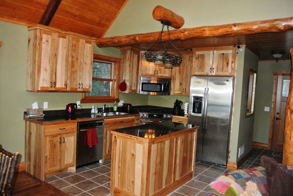 Stainless Steel Appliances and Hickory Cabinets in the Kitchen.