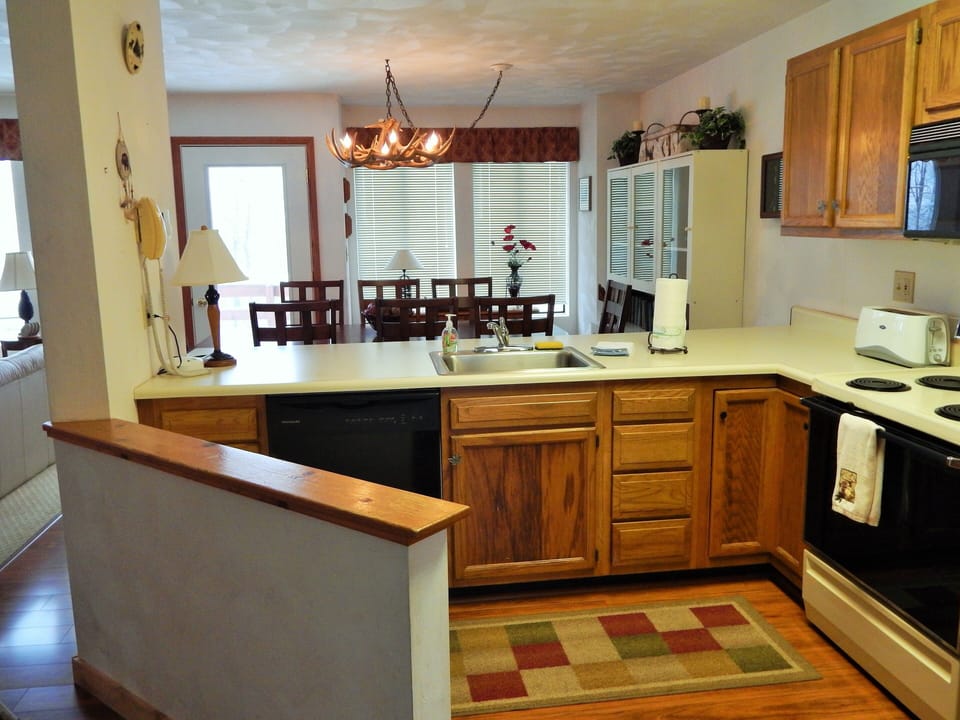 fully equipped kitchen microwave coffee pot range dishwasher