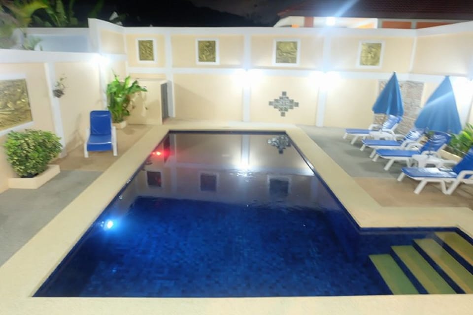 Majestic Villas 2,3 bedroom . Pool area at night time.