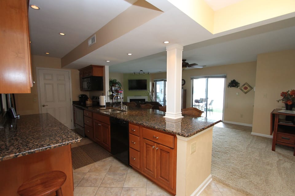 Custom kitchen cabinets, granite, and newer appliances. Counter seating for six.