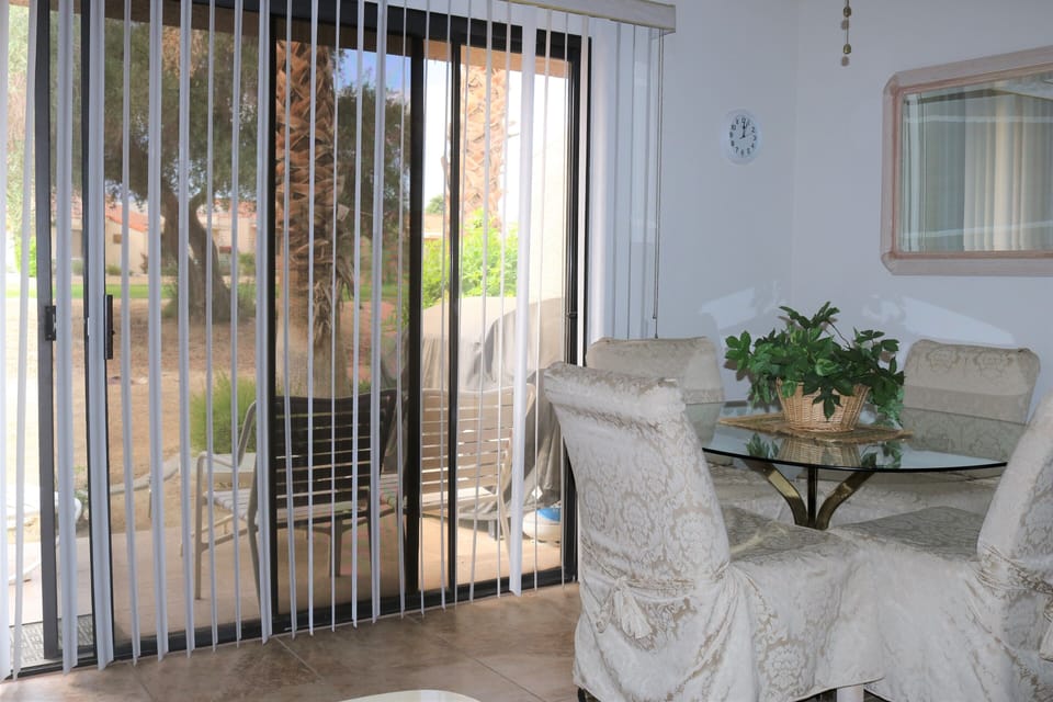 Patio  with chairs  and table and gas BBQ