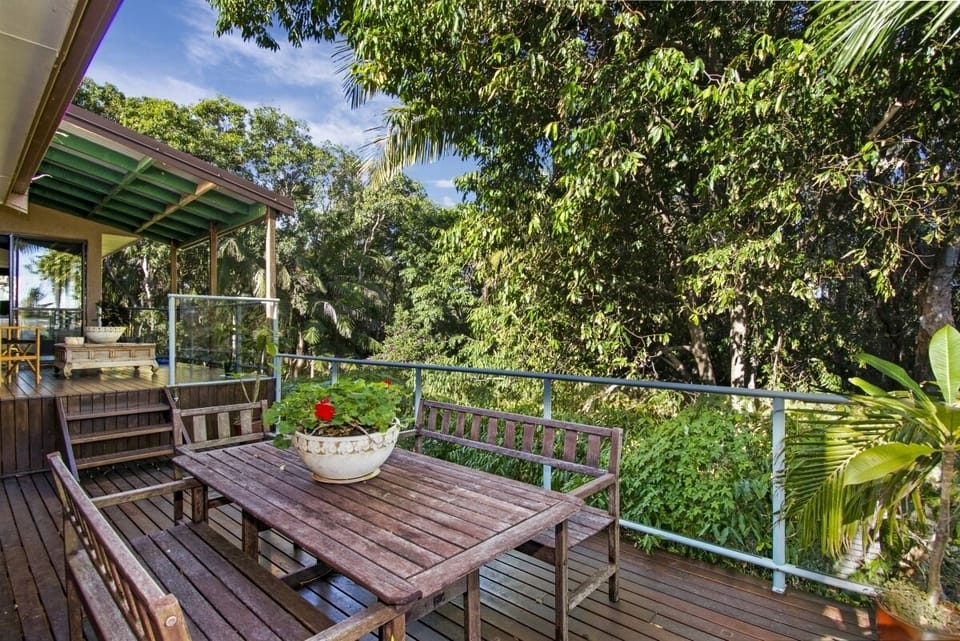 Front split level, wrap around deck overlooking treetops
