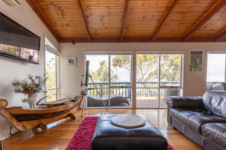 Lounge with open fire and ocean view