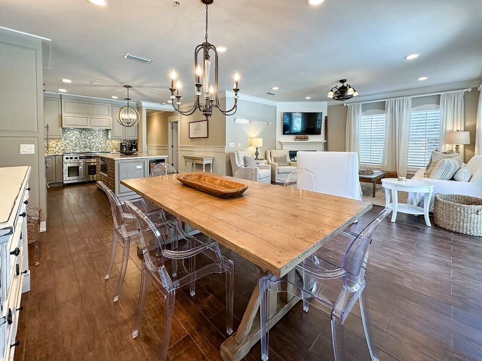 Sleek open kitchen, living & dining with resort views — double oven, Sub-Zero fridge, and wine cooler included!