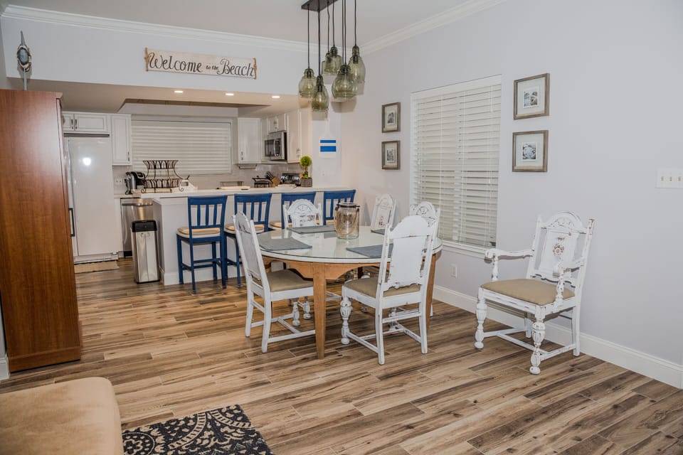 View from the living area into the dining area and kitchen