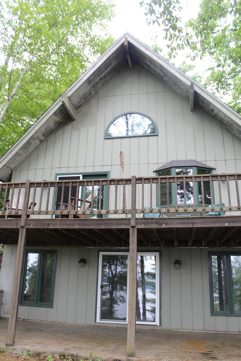 Back of house w deck & Adirondack chairs