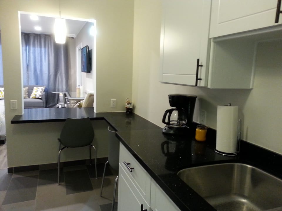 Kitchen with coffee maker, build in microwave and full size refrigerator