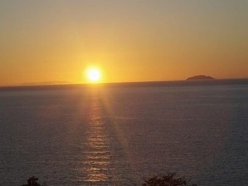 Watch the sunset over Desecheo Island, right from your balcony