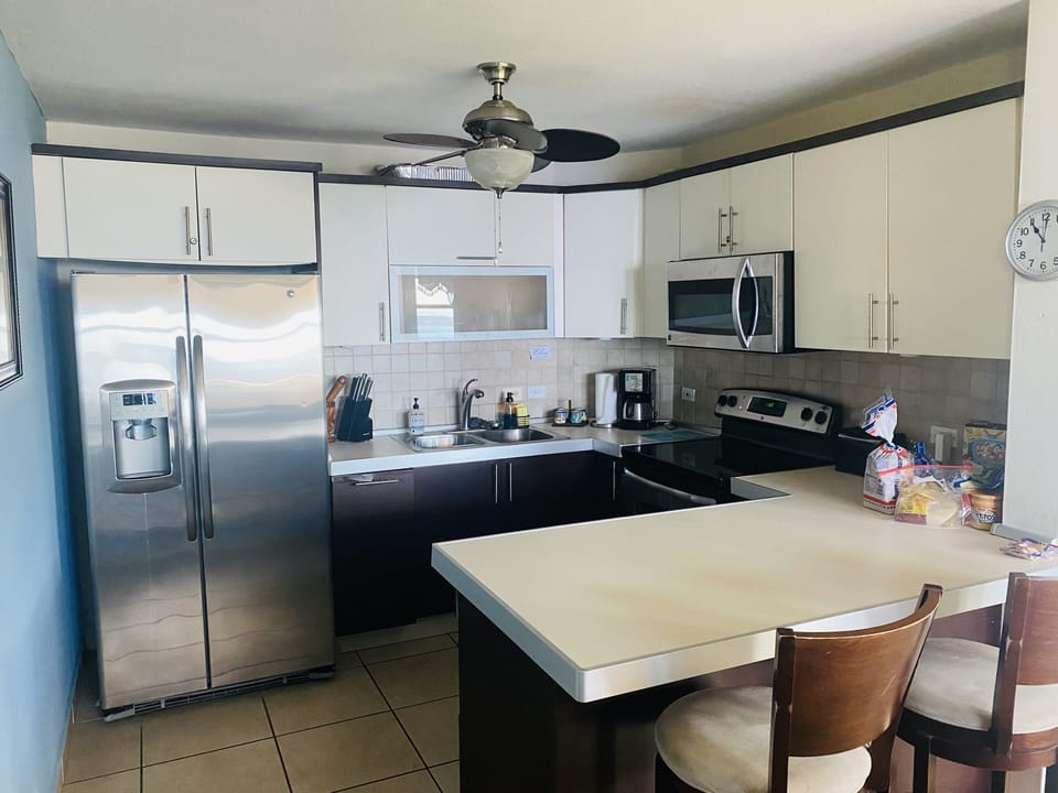 Fully equipped kitchen with  stainless steel appliances.