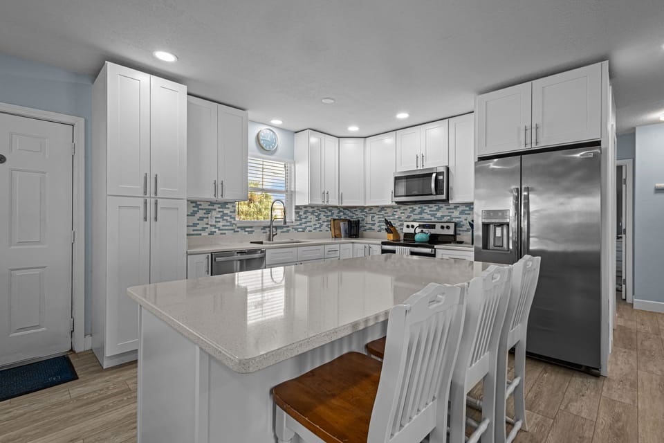 Kitchen with seating for 3 at the island.