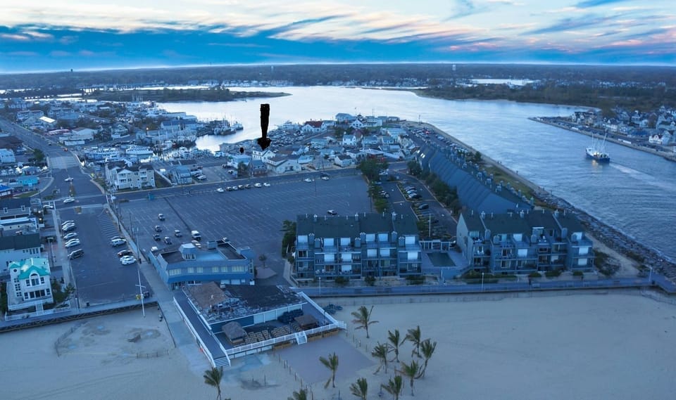 Aerial View with Arrow Pointing at House & Proximity to Beach