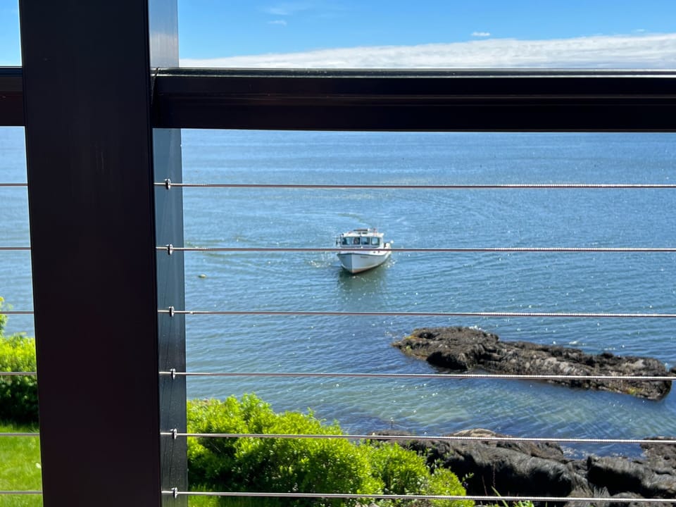 Sipping coffee on the central deck with lobsterman right in front of you